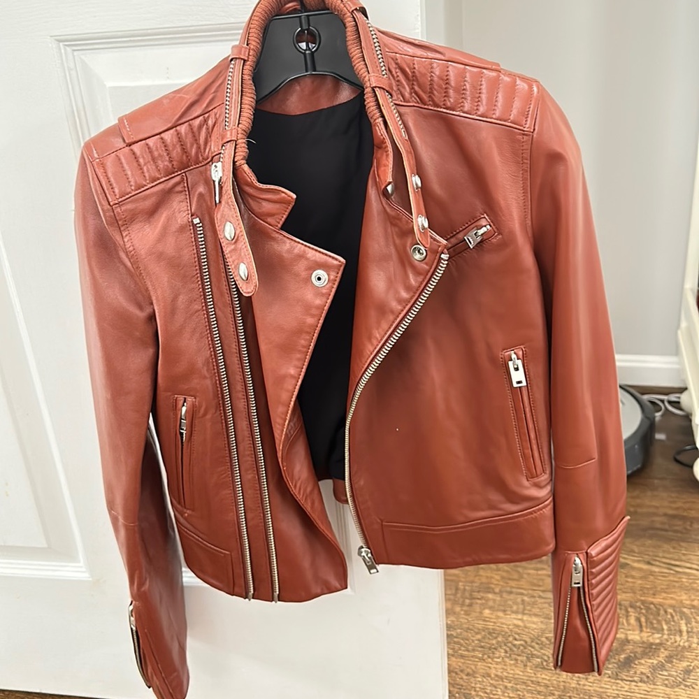 Idk brown leather jacket with silver hardware. Worn only a couple of times